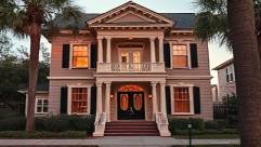 historic realtor home, majestic, revealing timeless elegance, photorealistic, set in an Orlando historic district, highly detailed, people walking by, super-high resolution, earthy tones, early evening lighting, shot with a 50mm lens